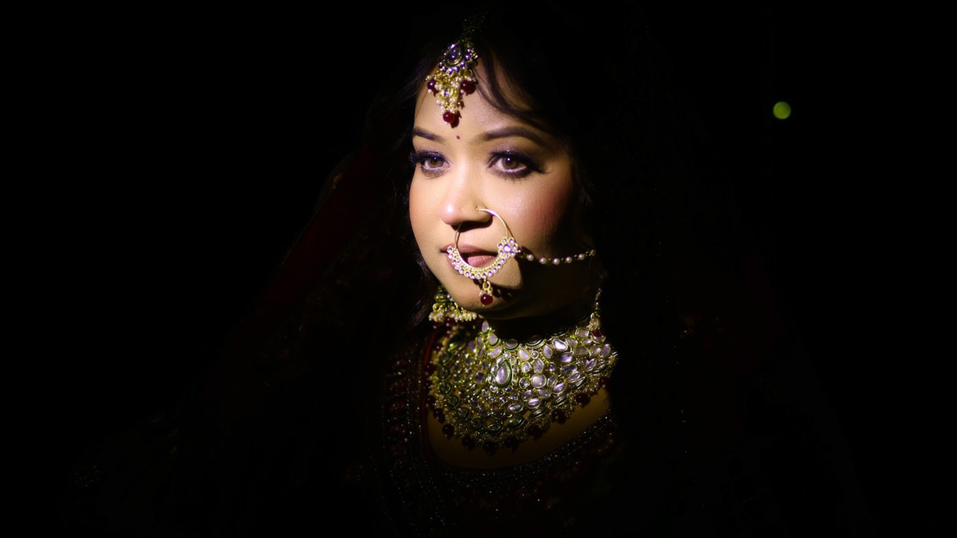 Premium bridal portrait by a leading Wedding Photographer in Ranchi with dramatic lighting and traditional jewellery.
