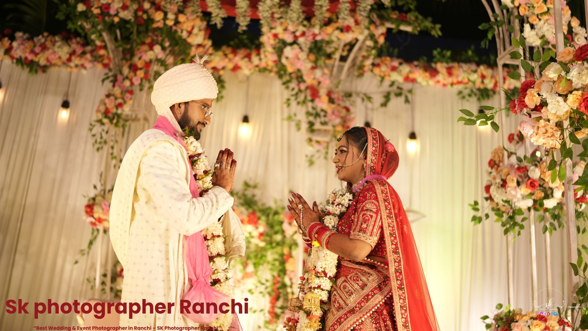Indian bride and groom exchanging respectful gesture during wedding ceremony, captured by a Wedding Photographer in Ranchi.